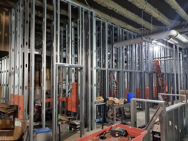 Walls being framed and backing installed for restroom off main lobby